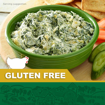 Bowl of gluten-free spinach artichoke dip in a green dish, served with chips and fresh vegetables, with a gluten-free label and chicken icon.